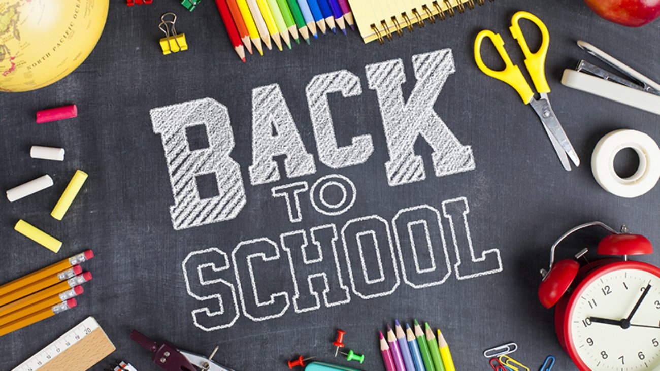 School supplies on blackboard background