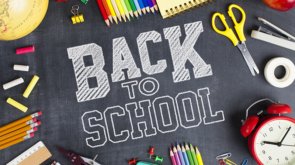 School supplies on blackboard background